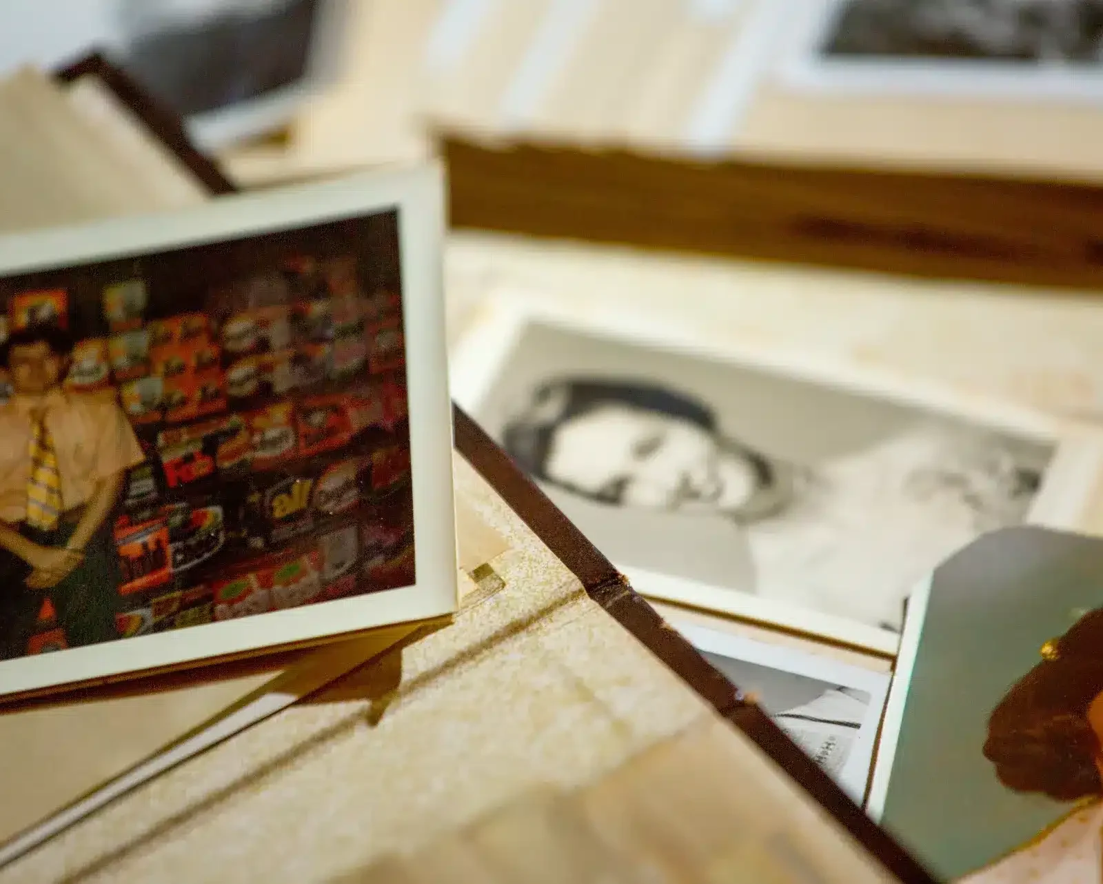 your-story Collection of vintage family photos spread across a table representing family legacy and heritage